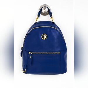 Tommy Hilfiger navy blue backpack featuring a domed design, gold embellishments.